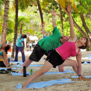 Yoga on the beach in Haiti. That's me in the pink.